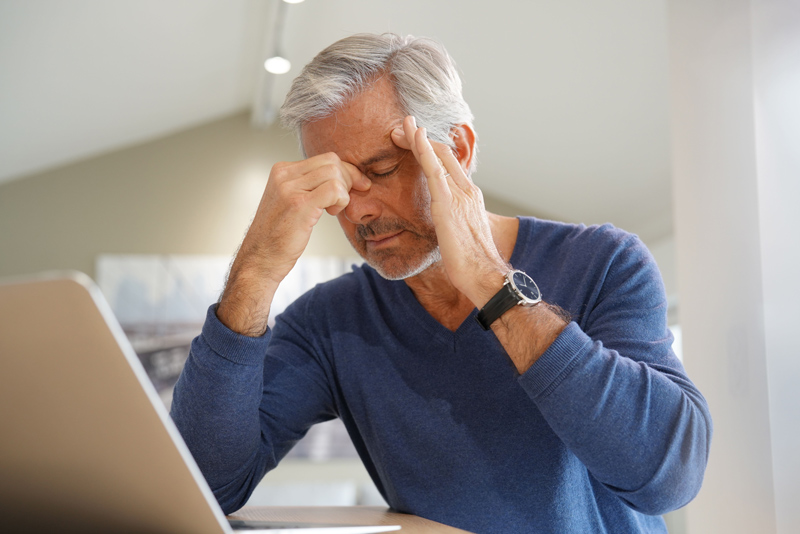 Senior with headache pain at an independent or assisted living community in South Surrey White Rock
